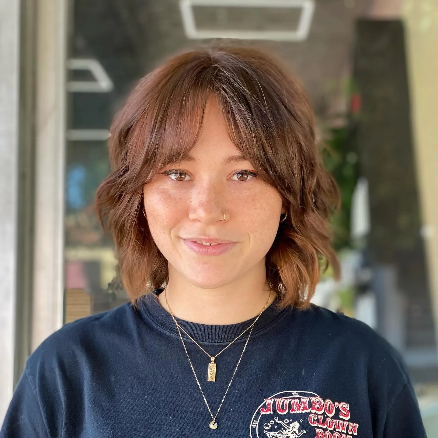 Wavy shaggy bob with curtain fringe and loose jaw-length layers