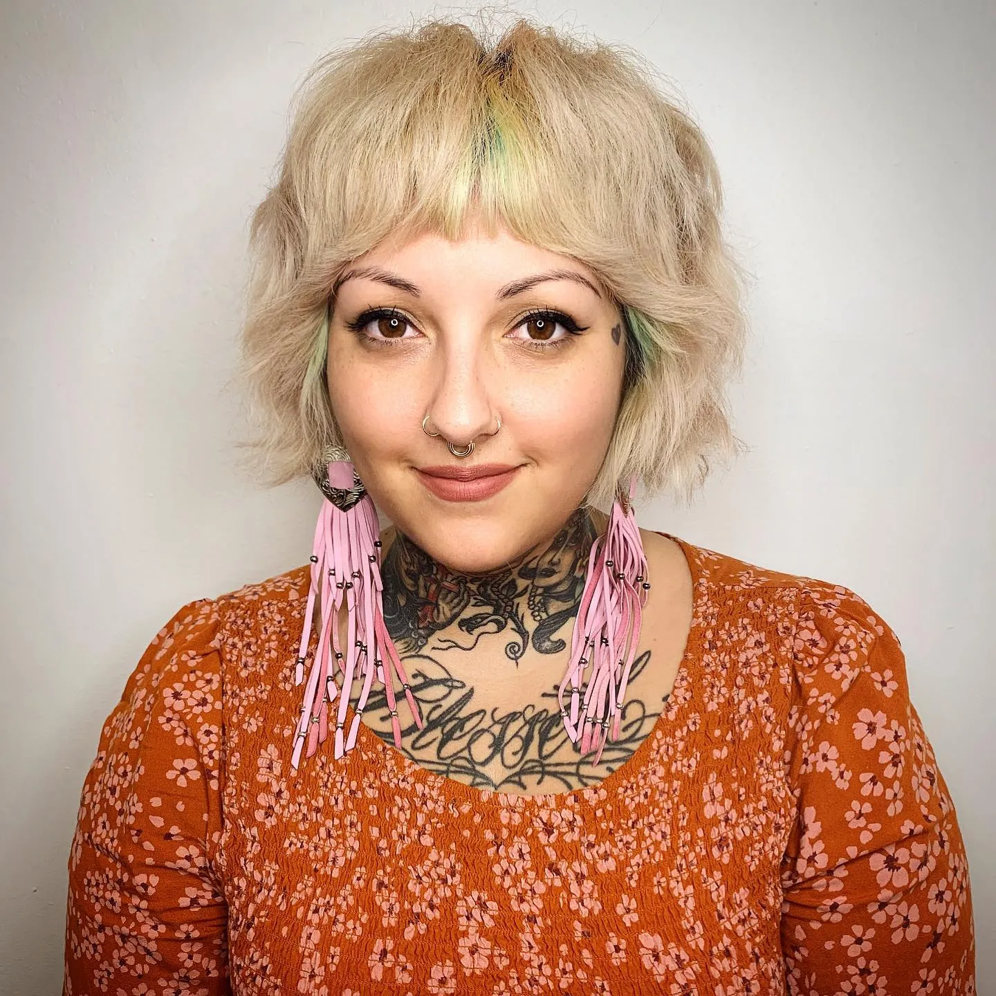 Choppy shaggy bob with rounded fringe and wispy neck-length layers