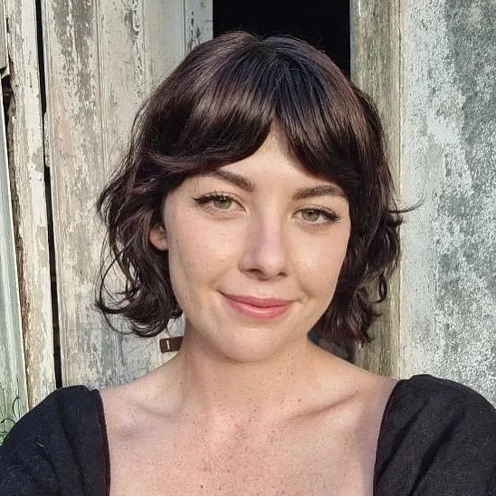 Soft wavy short bob with curtain fringe and curled jaw-length ends
