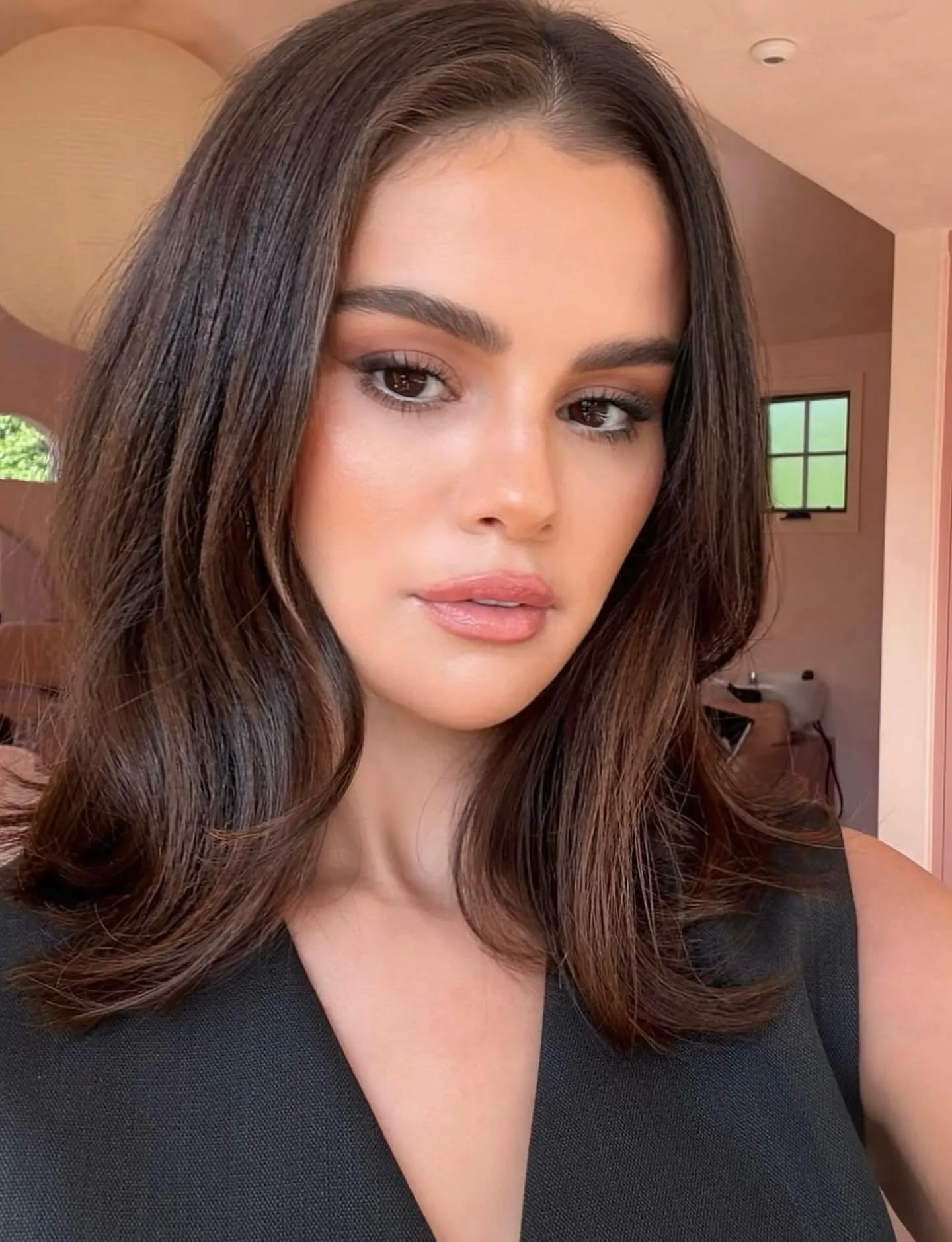 Sleek centre-parted lob with long layers and softly curved ends