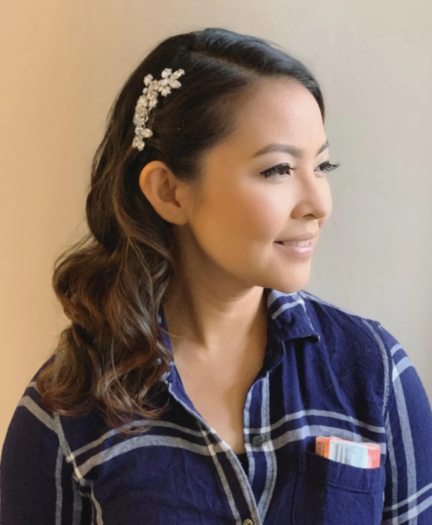 Dark side-swept waves with a jewelled bridal hair clip