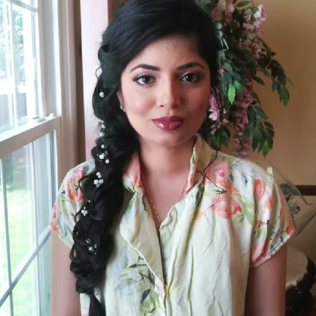 Long dark side braid decorated with small white flowers