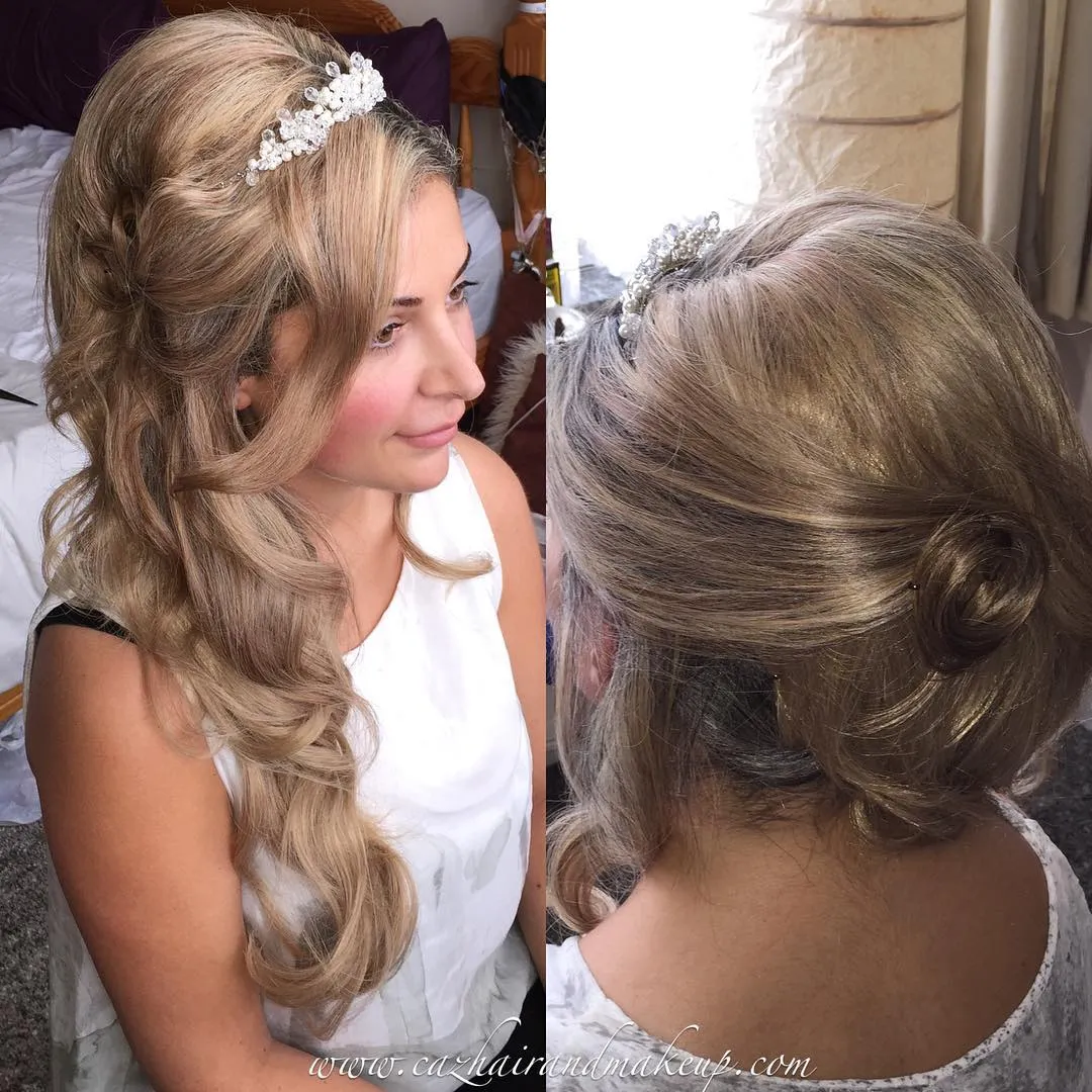 Long blonde curls swept sideways with twisted pinned sections