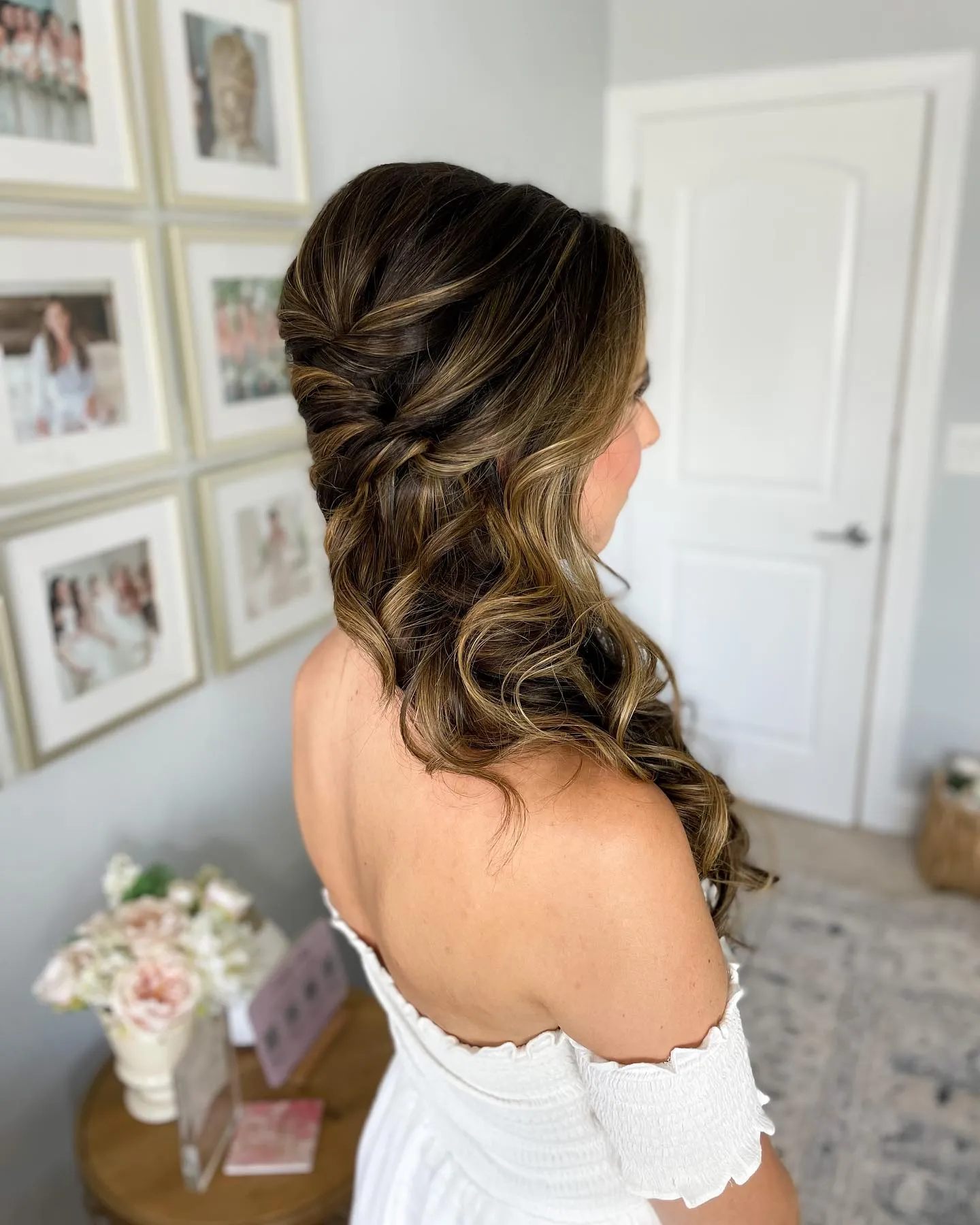 Brunette twists feeding into side-swept loose curls