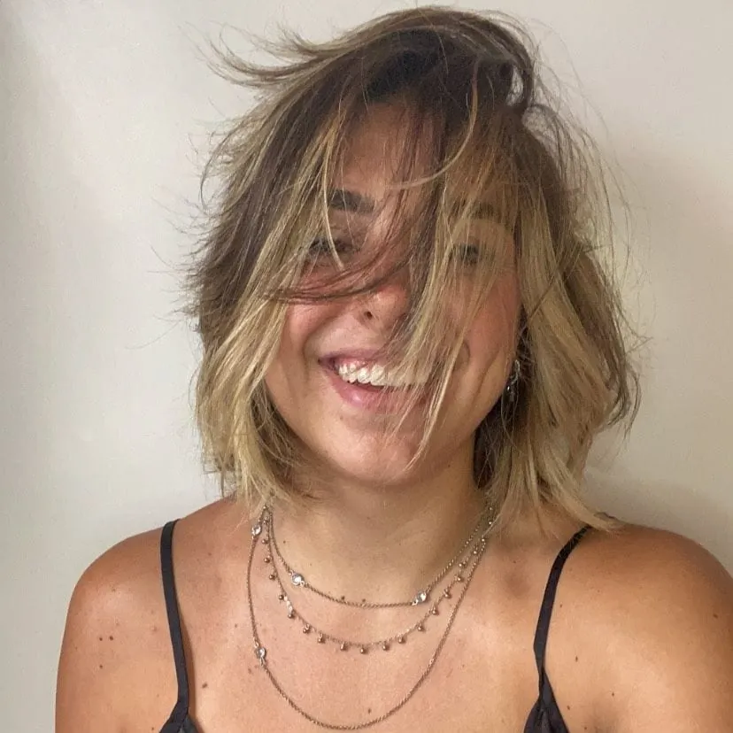 Tousled blonde bob with airy layers and face-framing movement