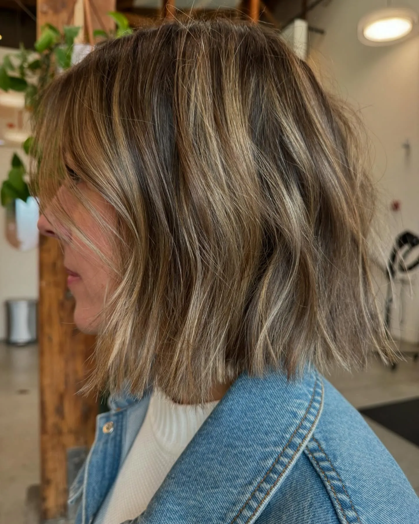 Shoulder-length highlighted bob with blunt ends and soft movement