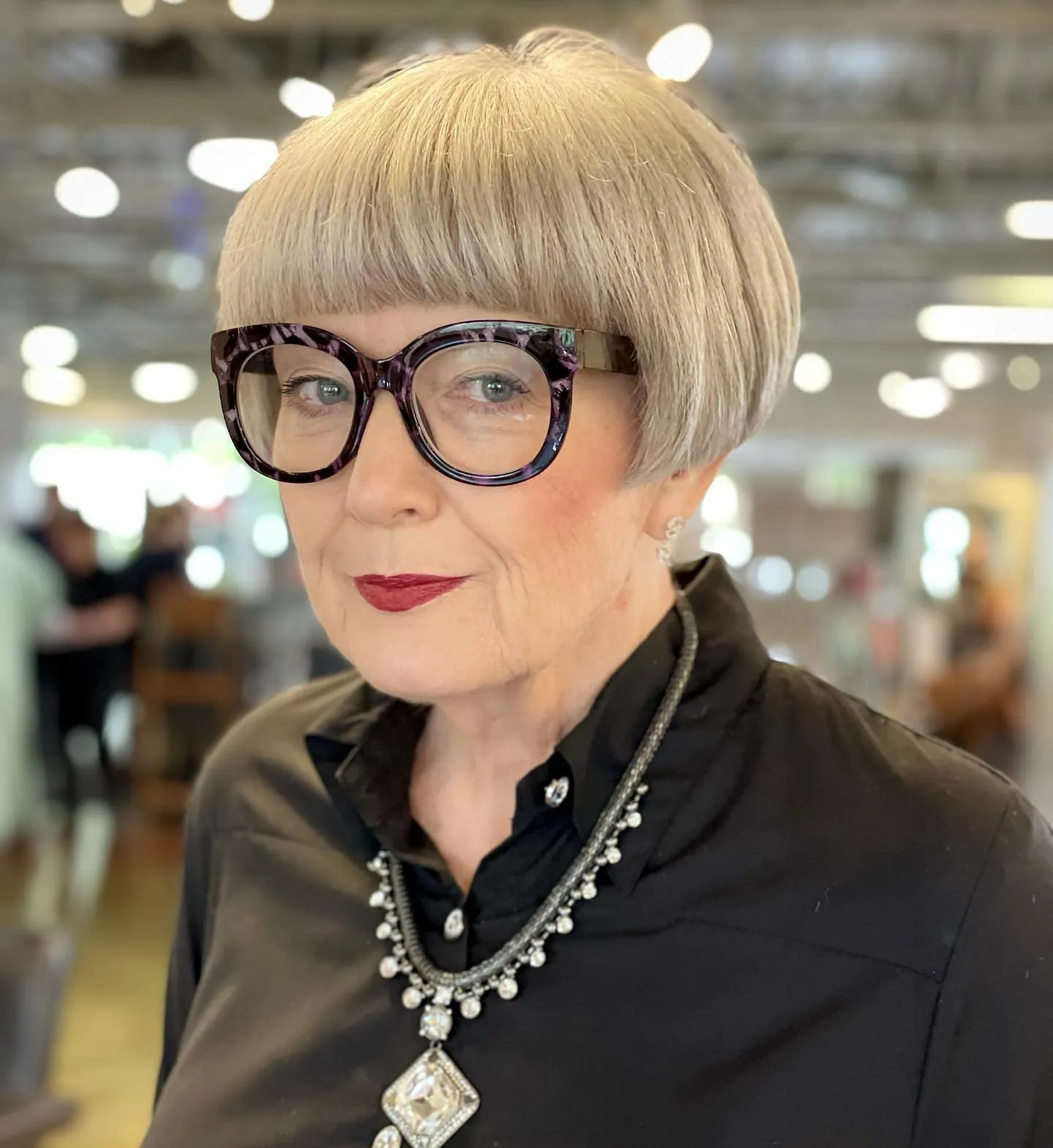 Short rounded blonde bob with a full blunt fringe