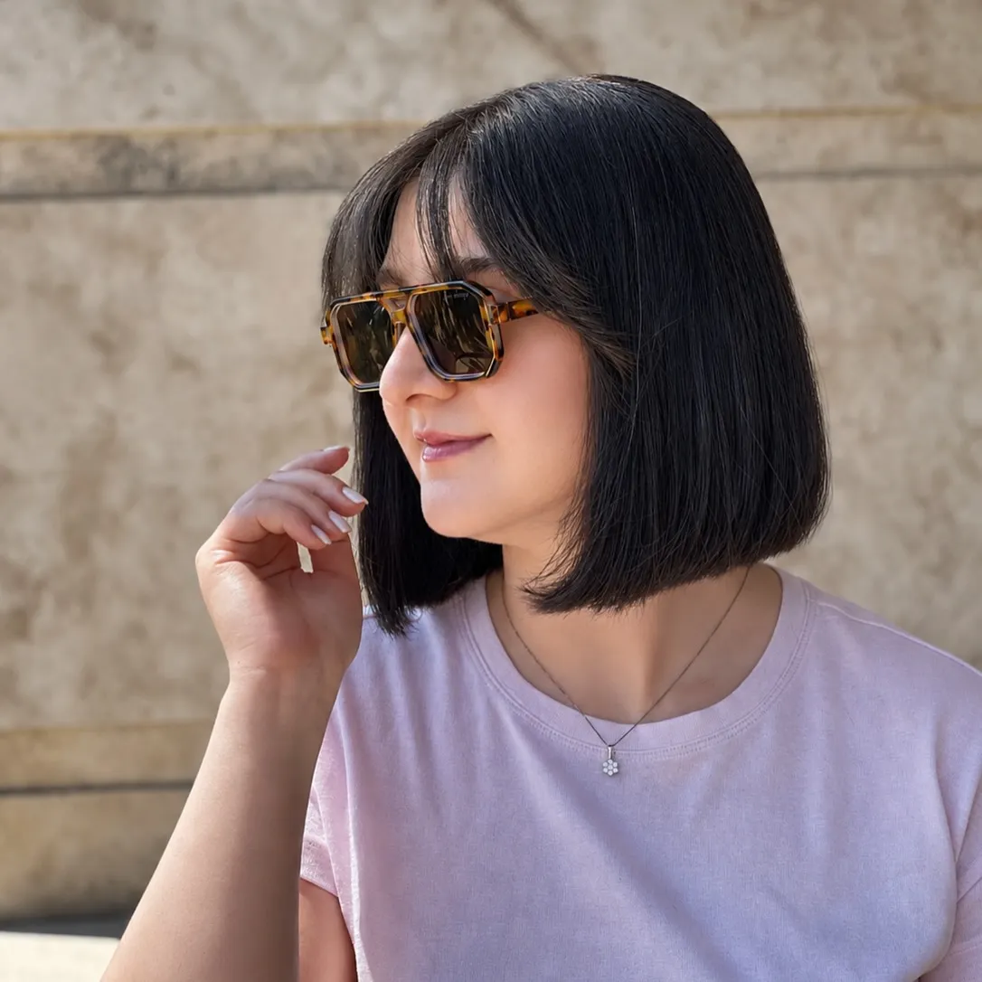 Black straight bob with soft fringe and blunt jaw-length ends