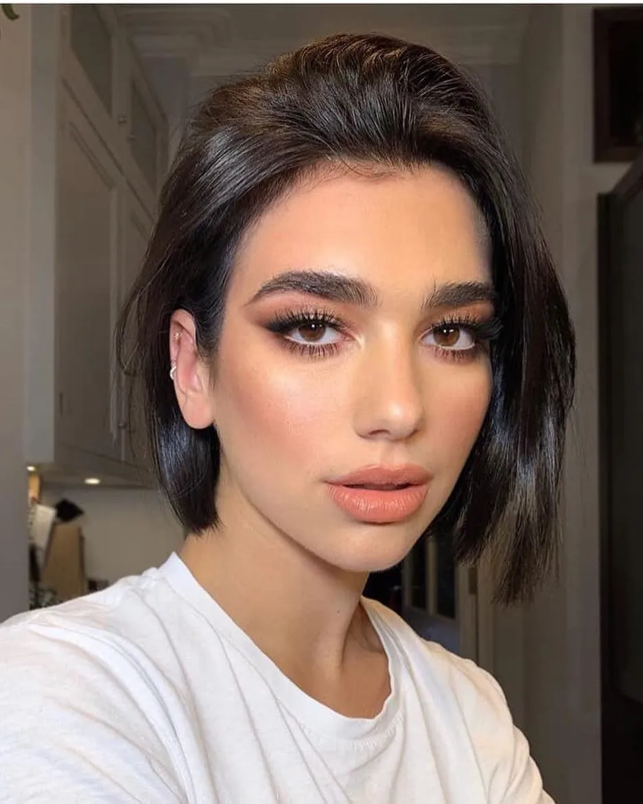 Dark straight jaw-length bob with a smooth centre part