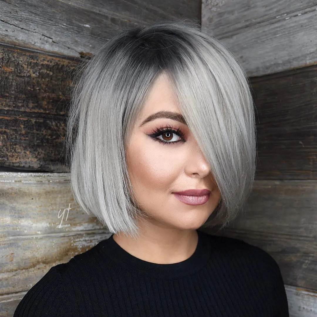 Silver straight angled bob with a deep sweeping side fringe