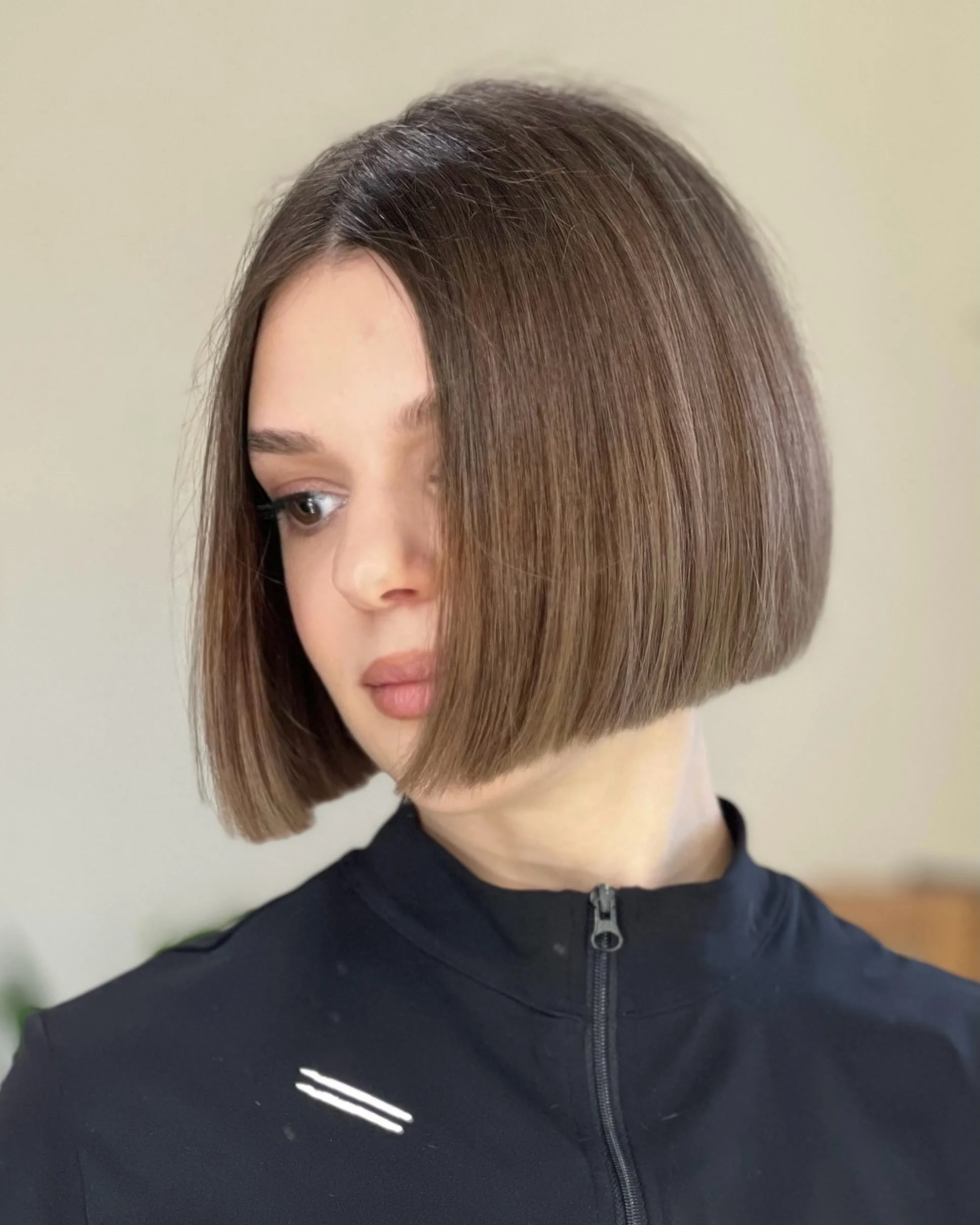 Brown straight chin-length bob with a clean centre part