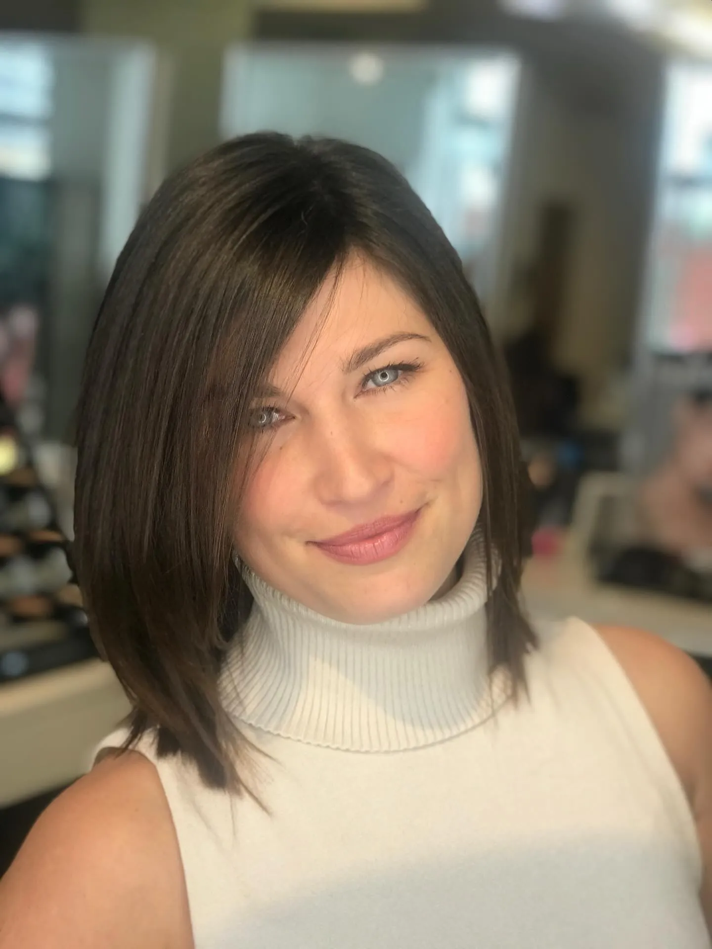 Brunette asymmetrical straight bob with a long side-swept front