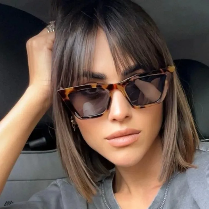 Brown straight bob with wispy fringe and subtle lighter ends