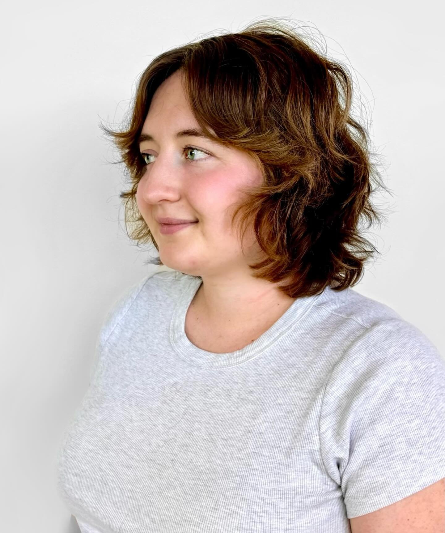 Shaggy tousled bob with curtain fringe and flipped layers