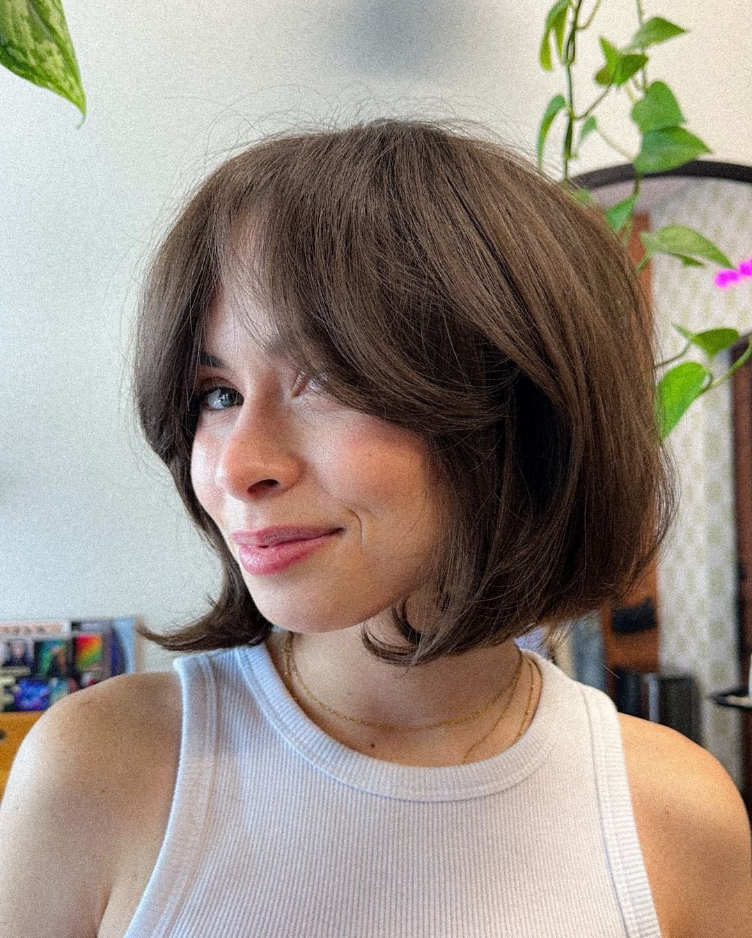 Chin-length bob with curtain fringe and feathered ends