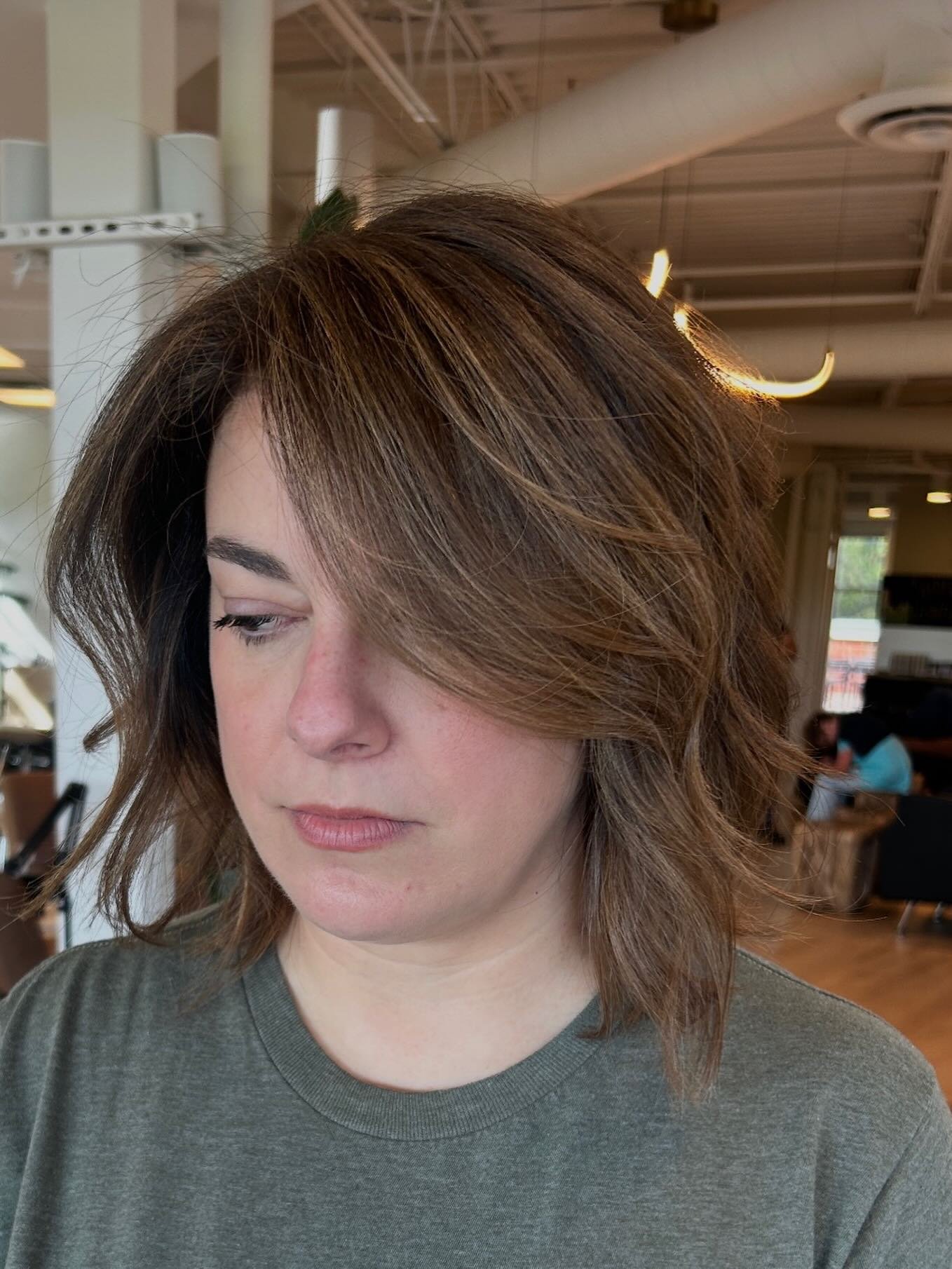 Deep side-parted bob with piecey layers and long sweeping fringe