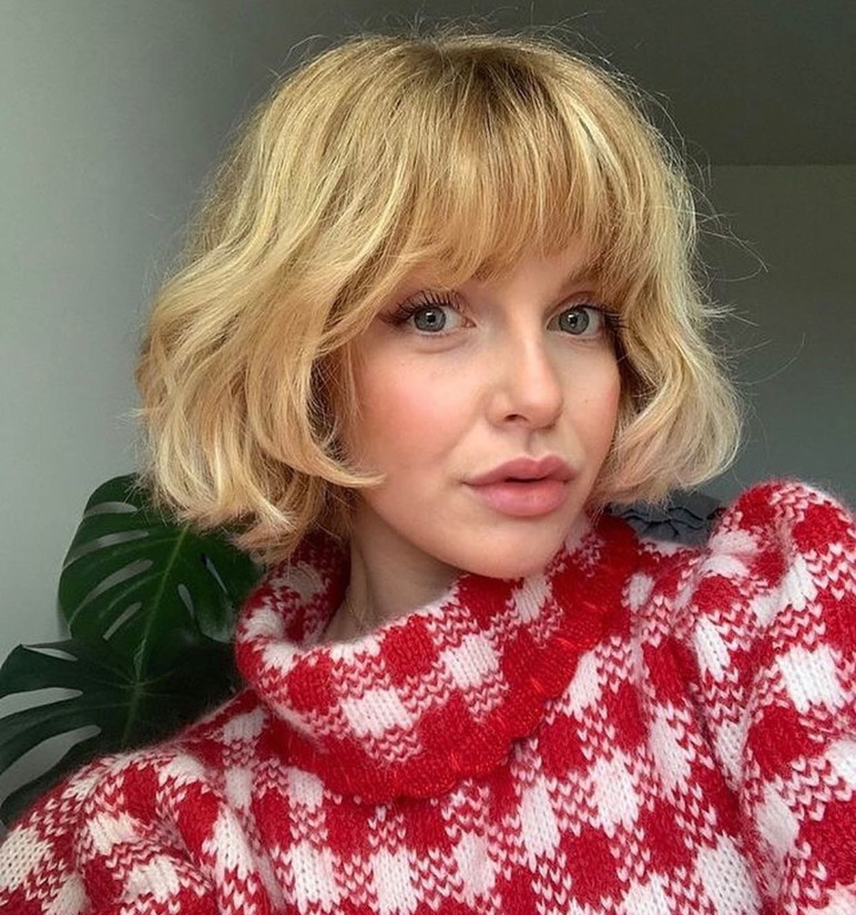 Soft wavy bob with full fringe and rounded volume