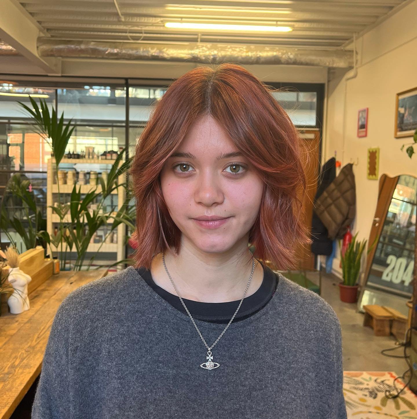 Layered bob with centre-parted fringe and flicked ends