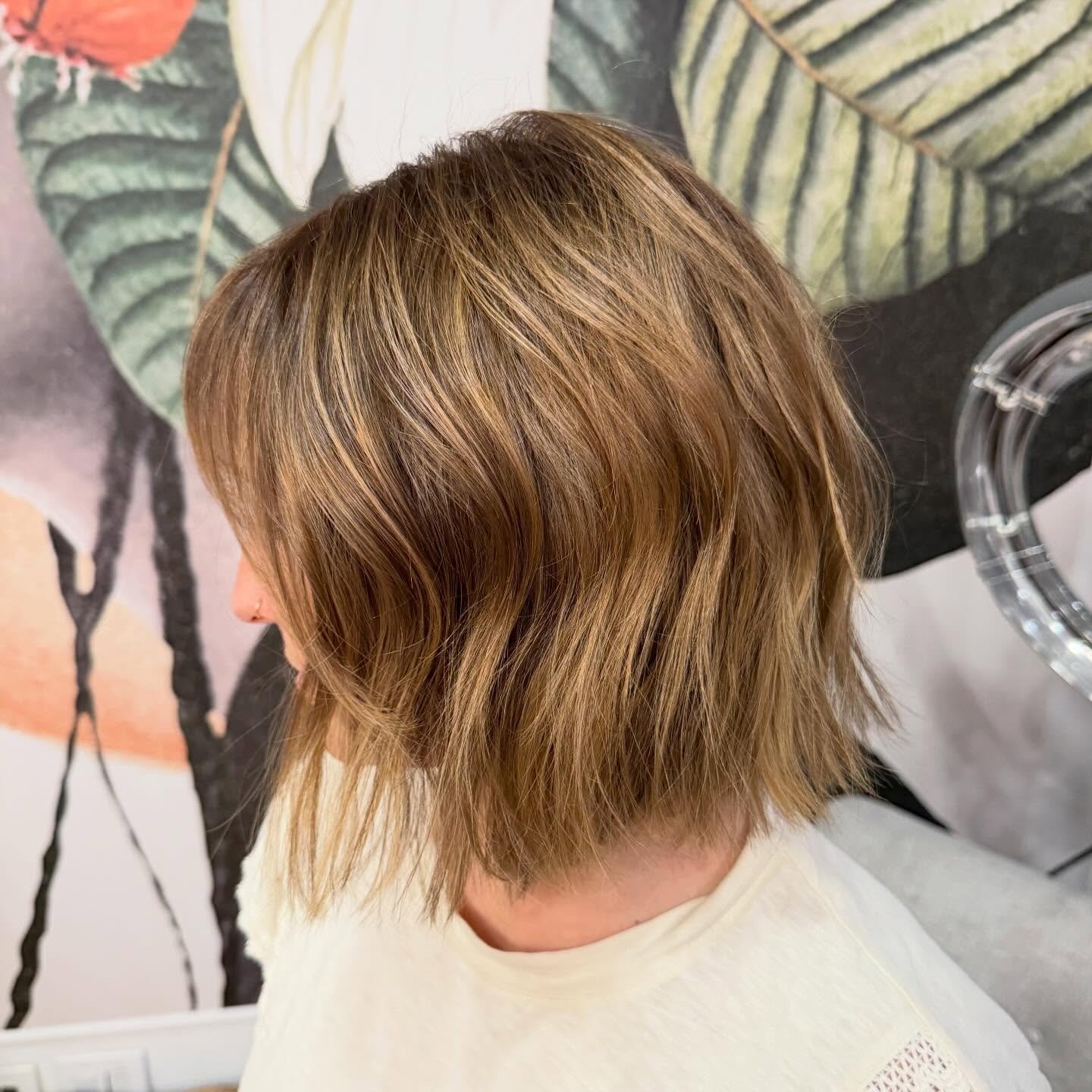 Blunt tousled bob with soft movement and side-swept front