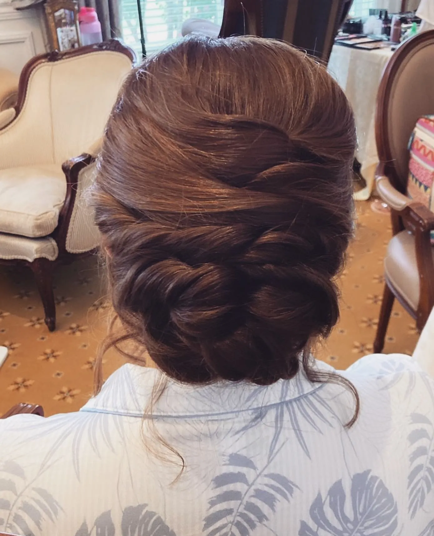 Full French twist updo for short brown hair with crown volume