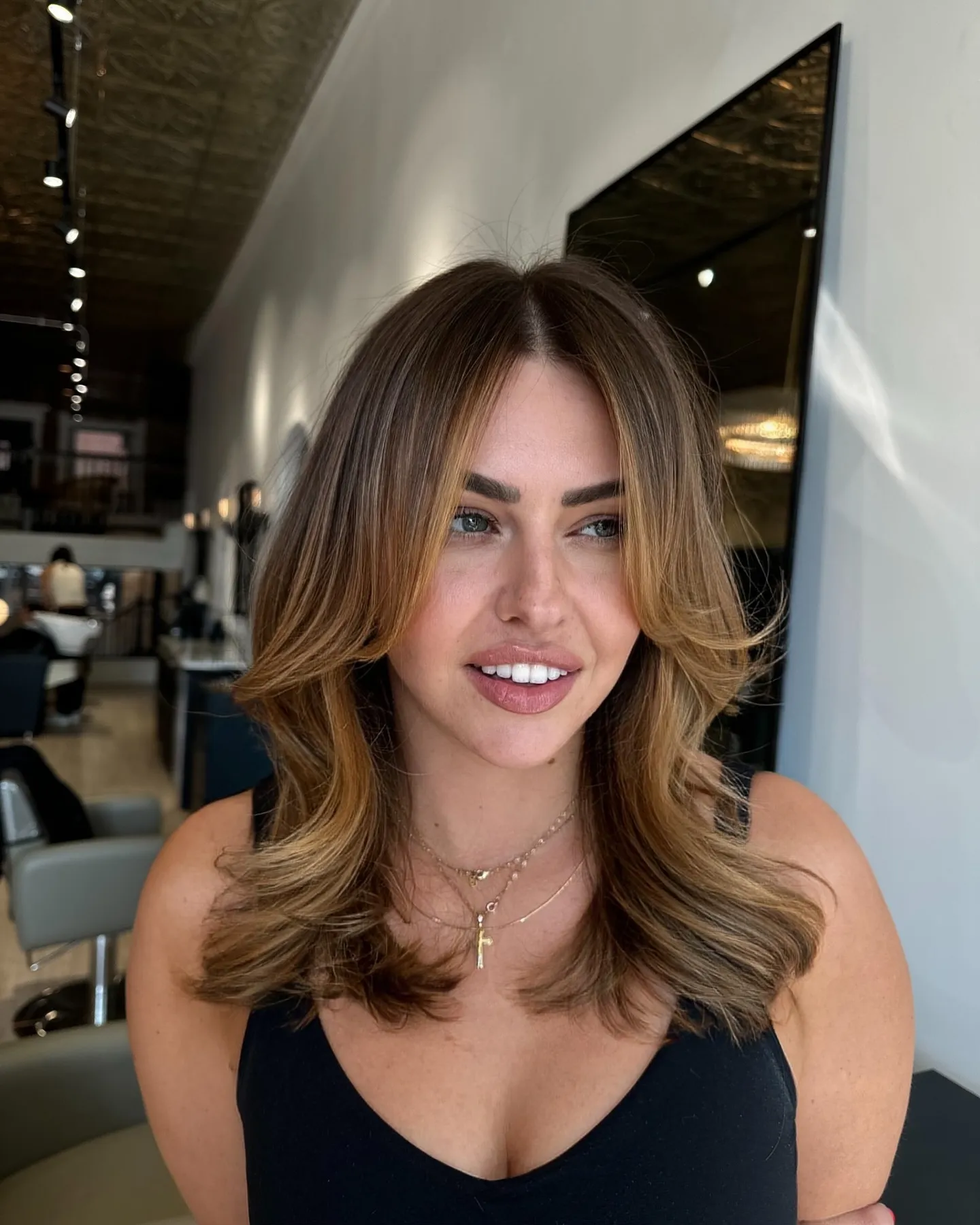 Layered brunette hair with soft blonde ribbons