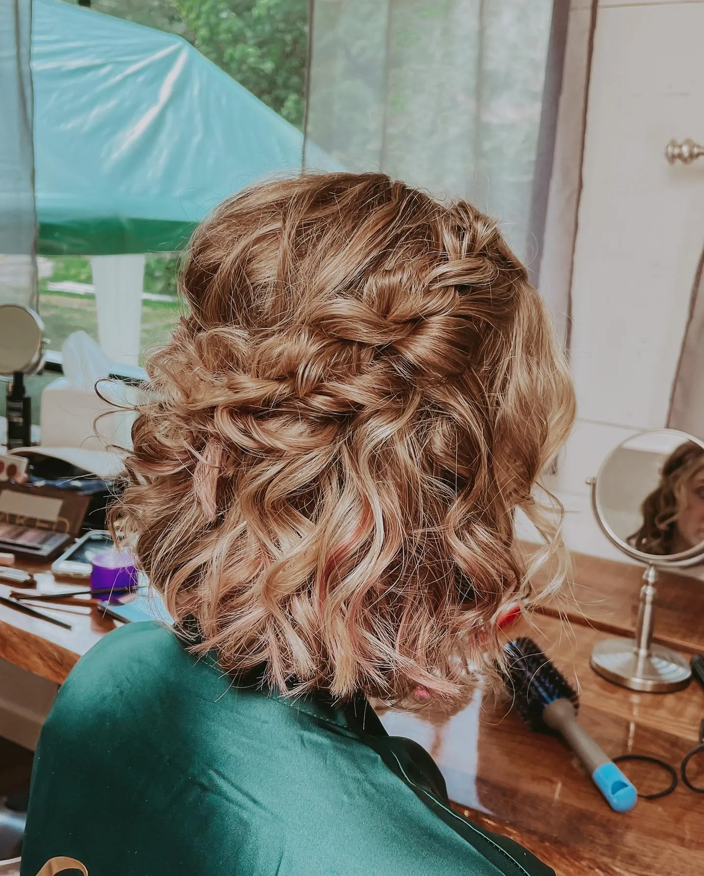 Braided half-up bob with soft curls