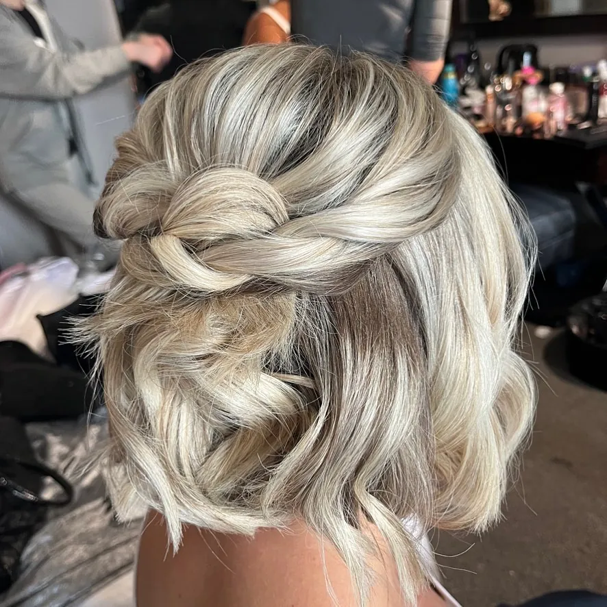 Curled bob with a braided half-up twist