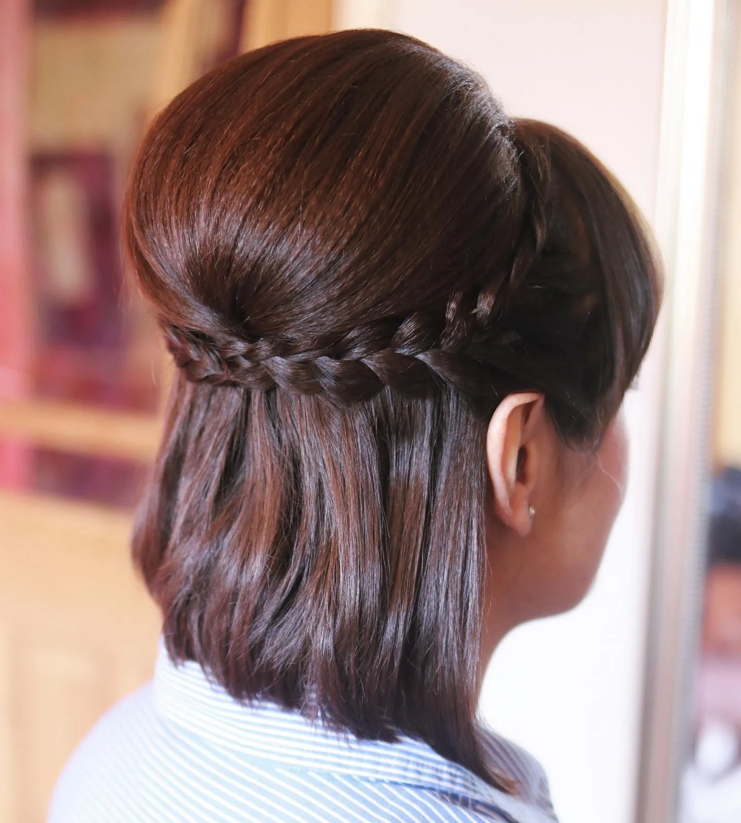 Straight bob with a narrow braided half-up section