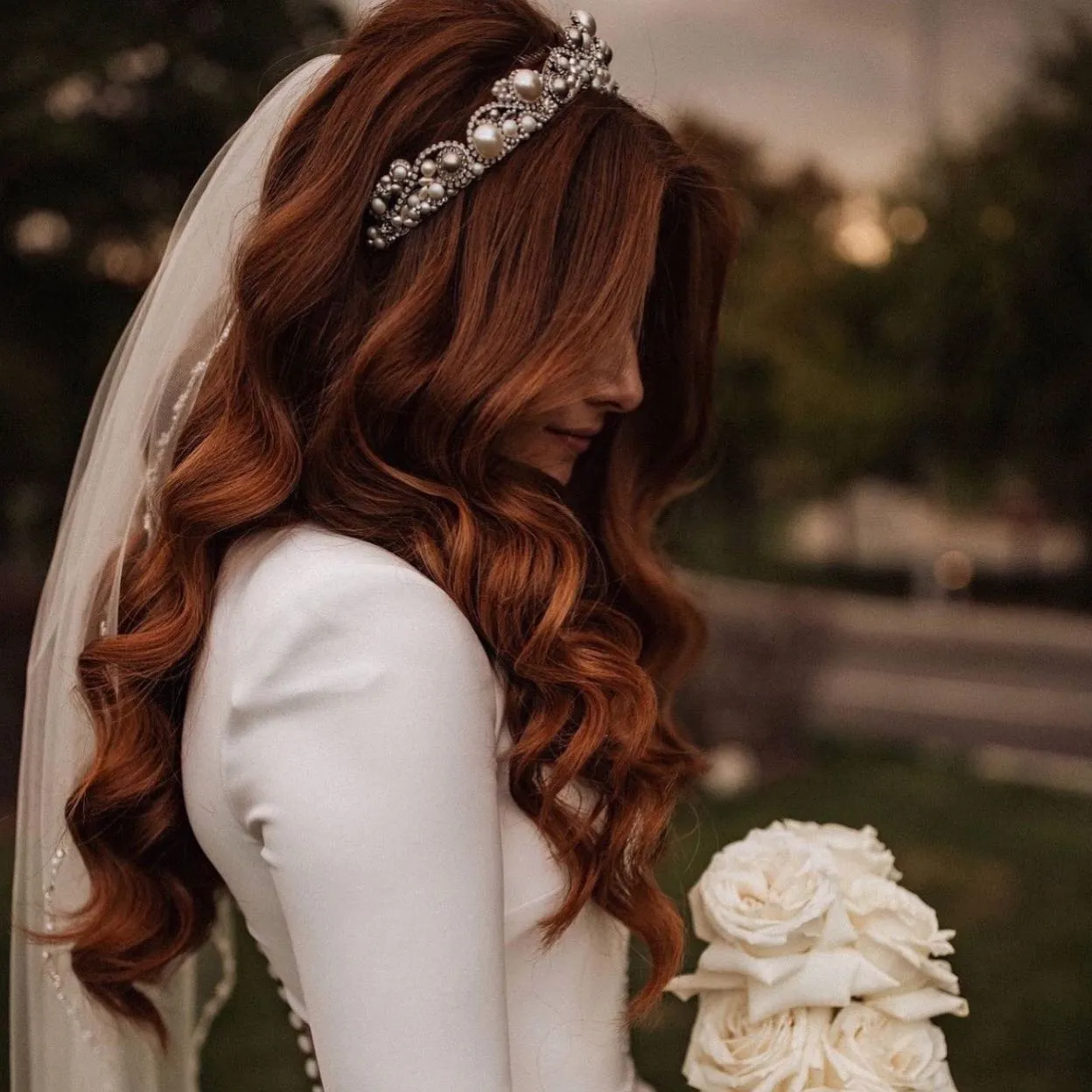 Long auburn wedding waves with a crystal tiara