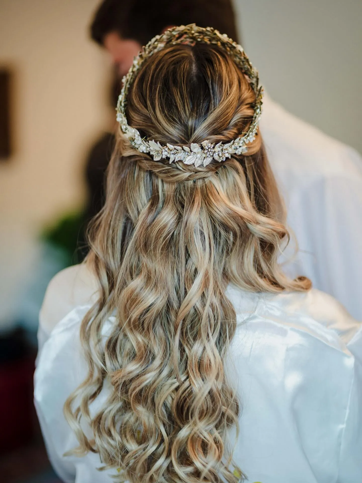 Braided half-up waves with a silver floral crown