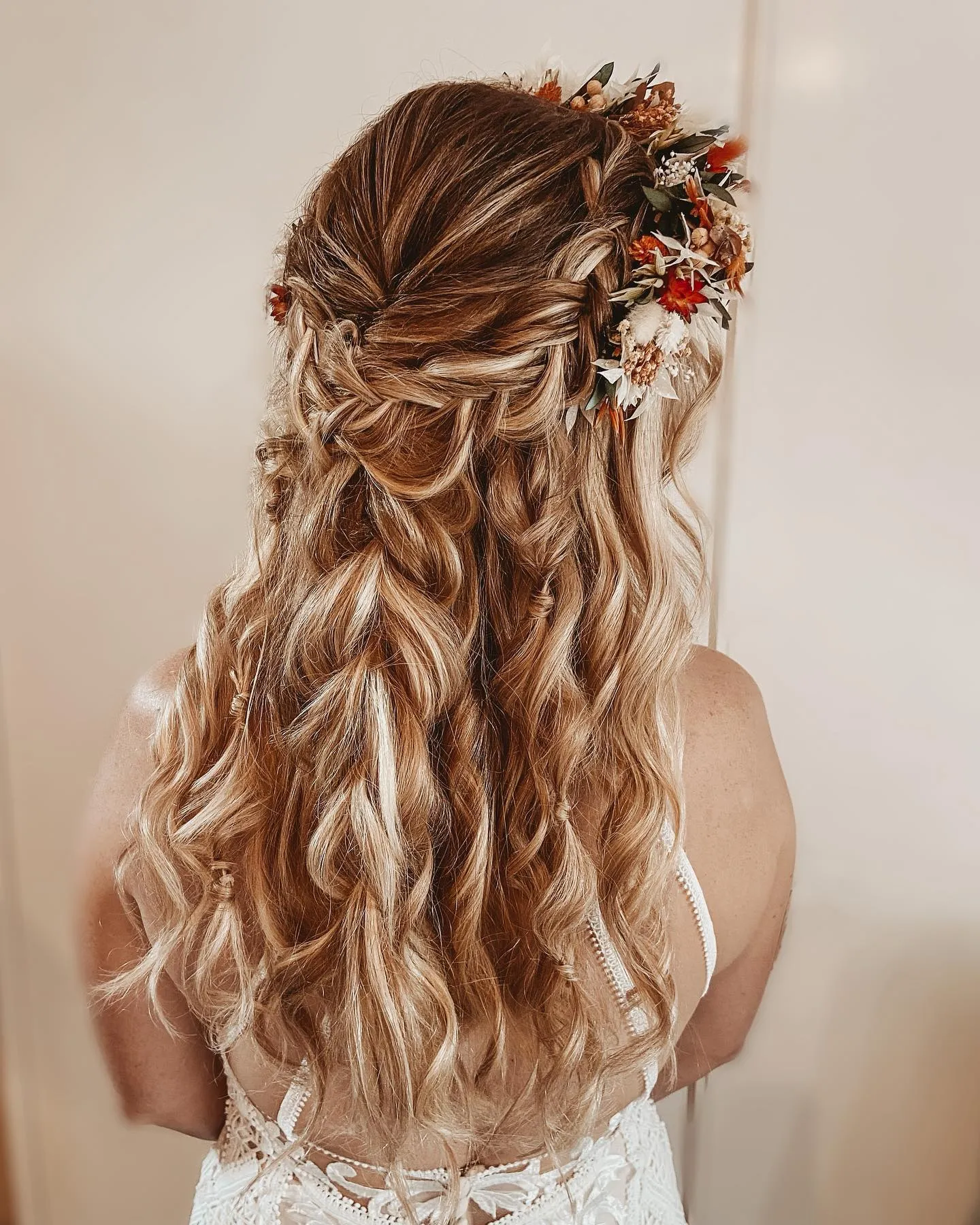Braided half-up curls with a dried flower crown