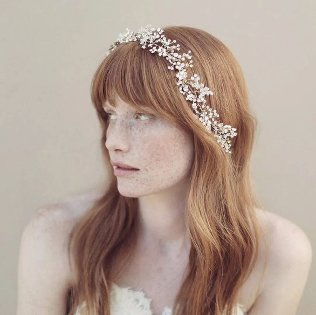 Long red bridal hair with a full fringe and crystal headband