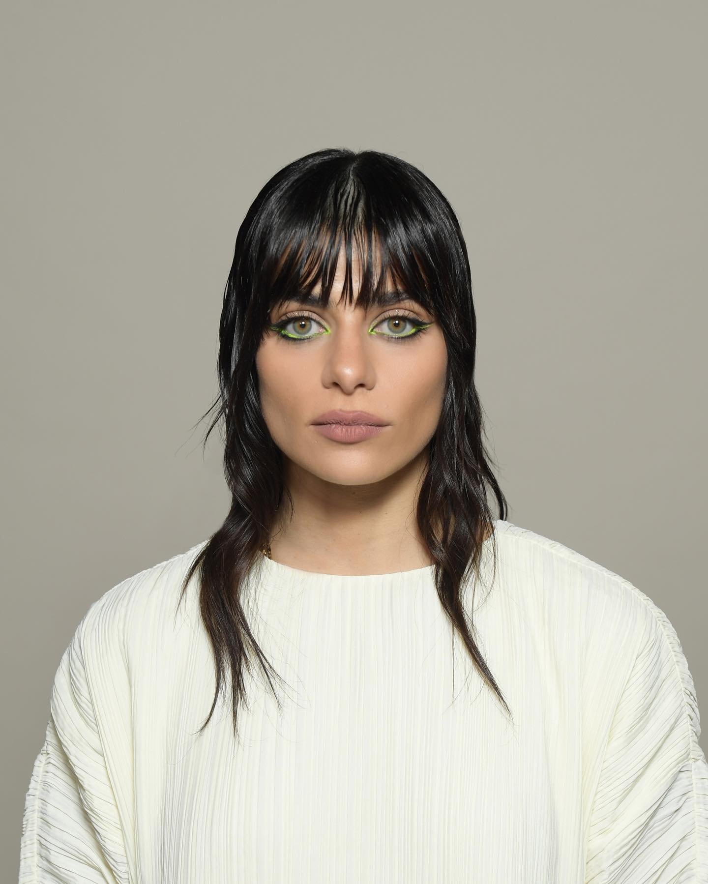 Long sleek wolf cut with separated fringe and extended face-framing pieces