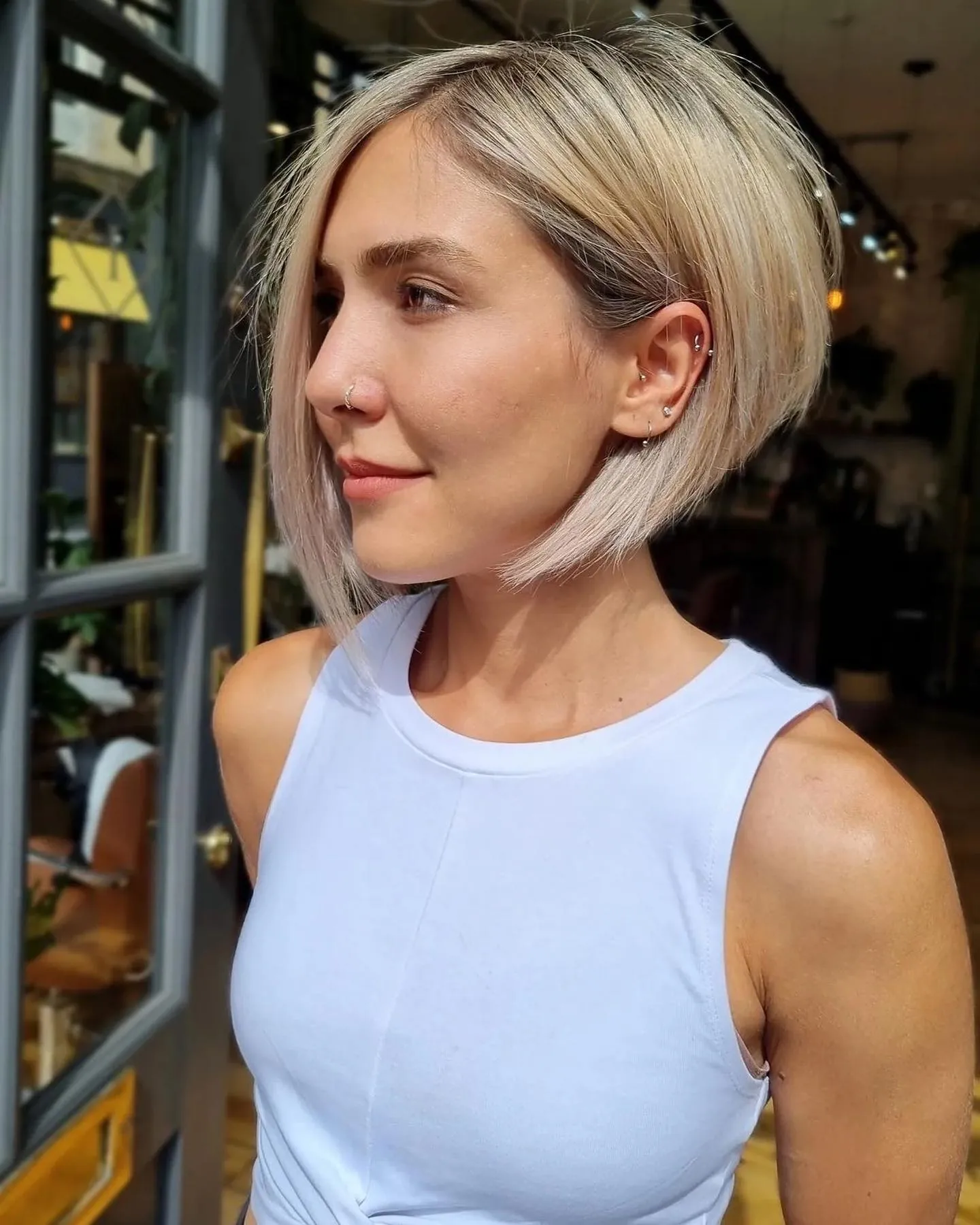 Short tucked A-line bob with sleek straight finish