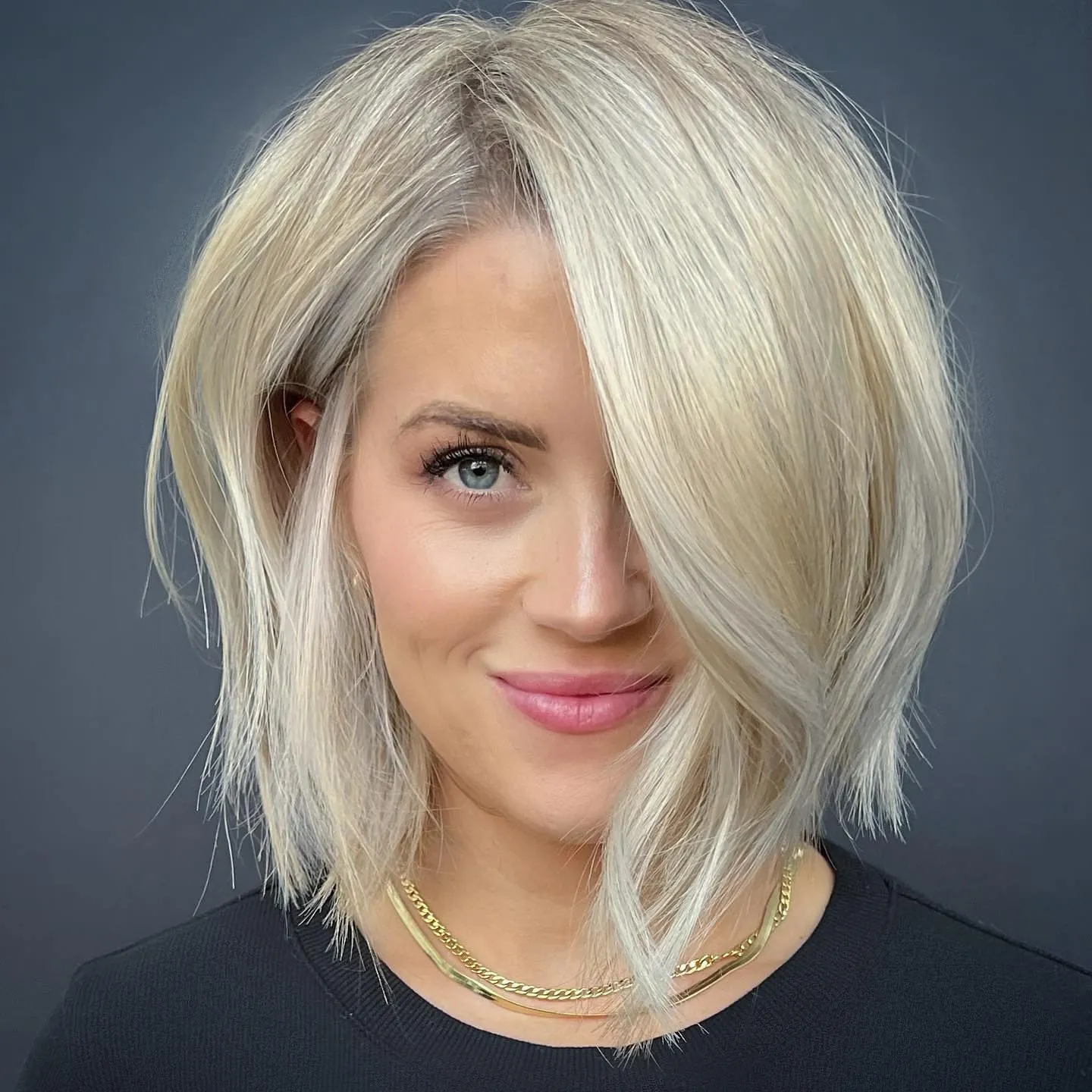 Layered blonde A-line lob with side-swept front