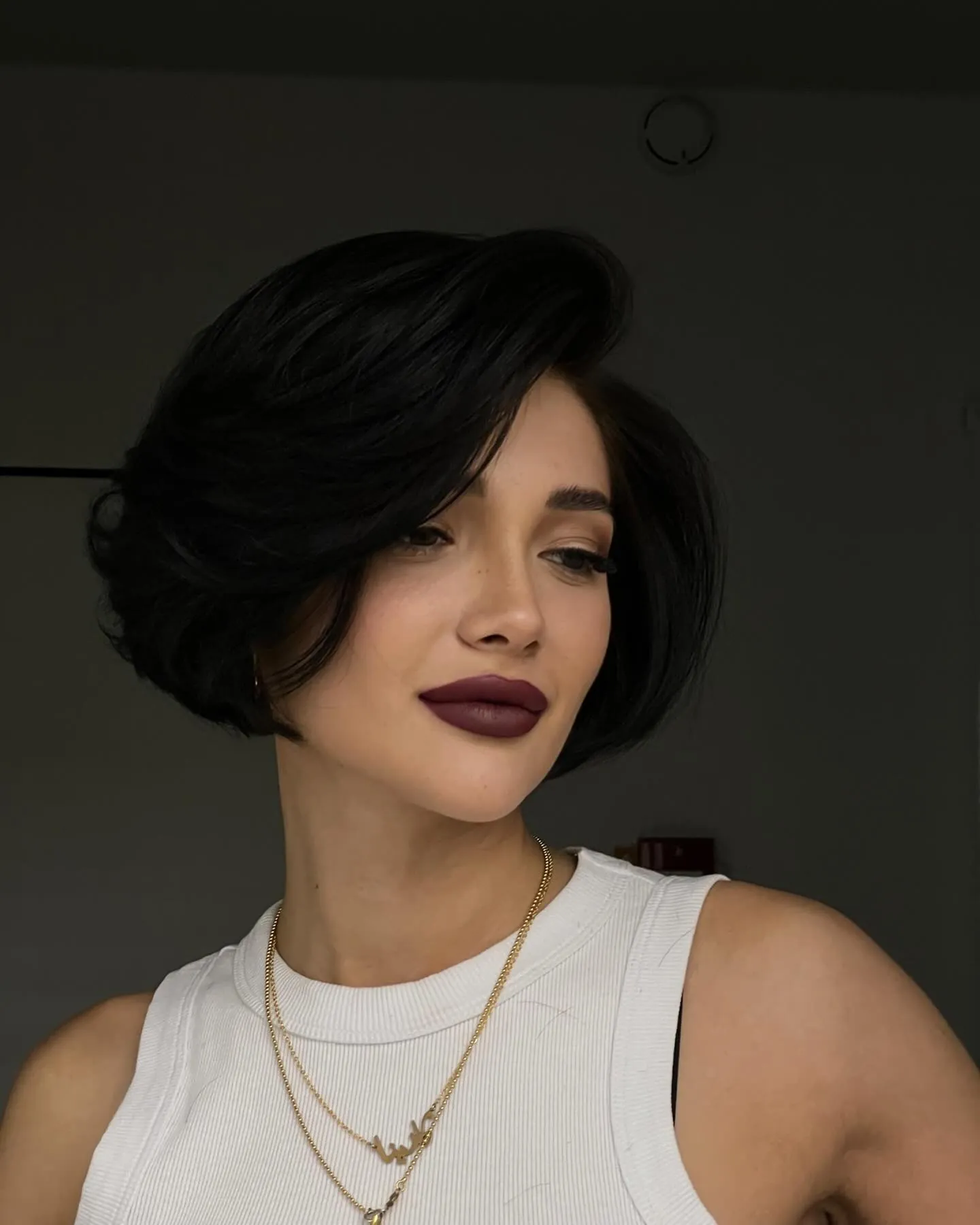 Voluminous side-parted black A-line bob