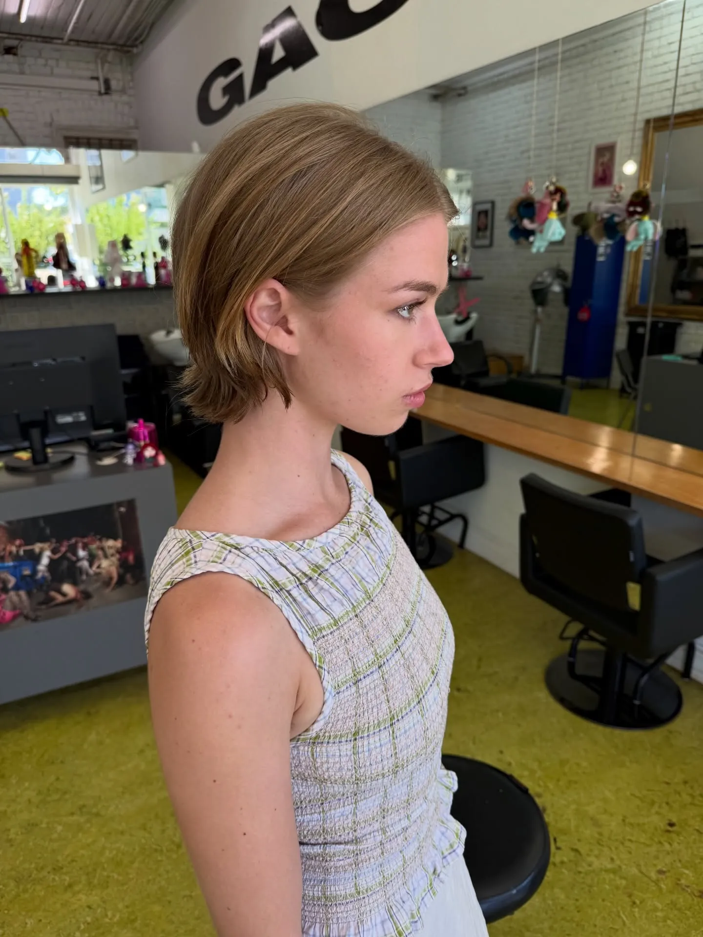Short tucked bob with ends flipped outward at the nape