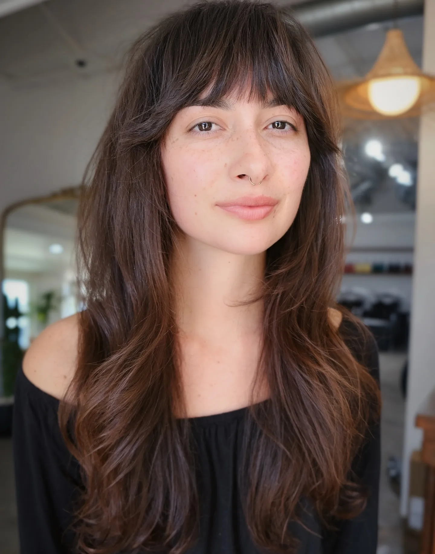 Long brunette hair with light airy Birkin bangs