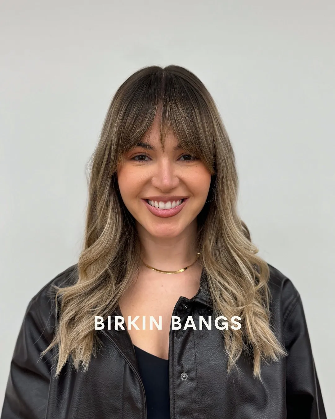 Wavy long hair with soft center-split Birkin bangs