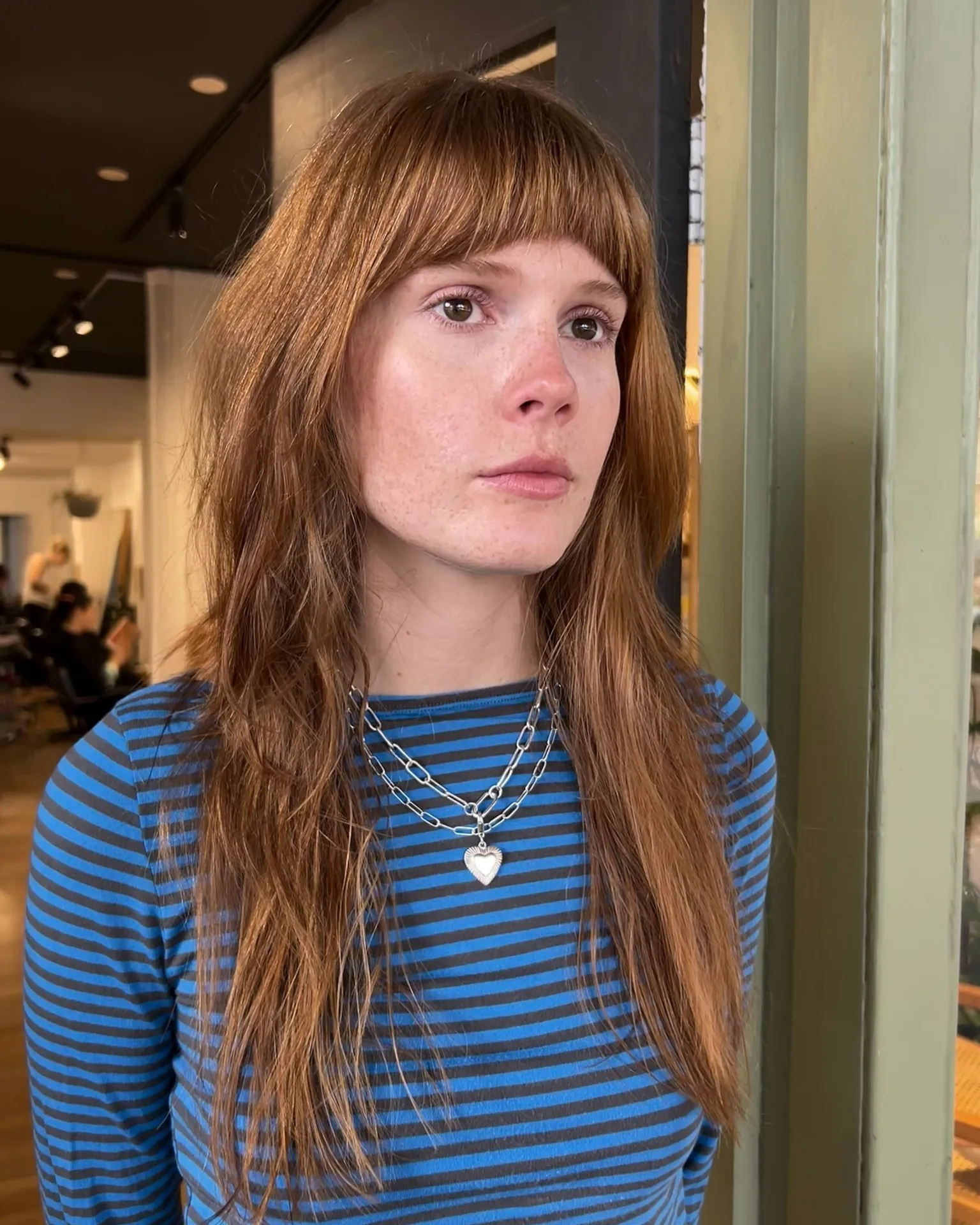 Long straight hair with fuller blunt Birkin fringe