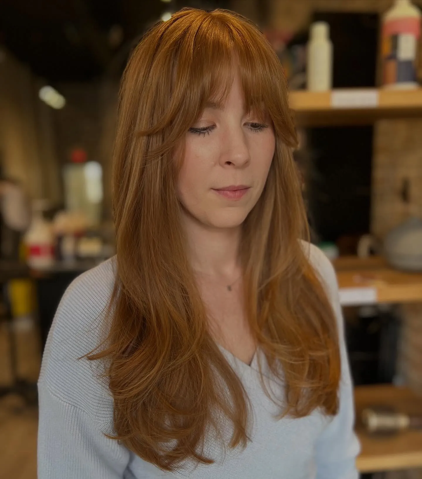 Long layered hair with soft extended Birkin fringe