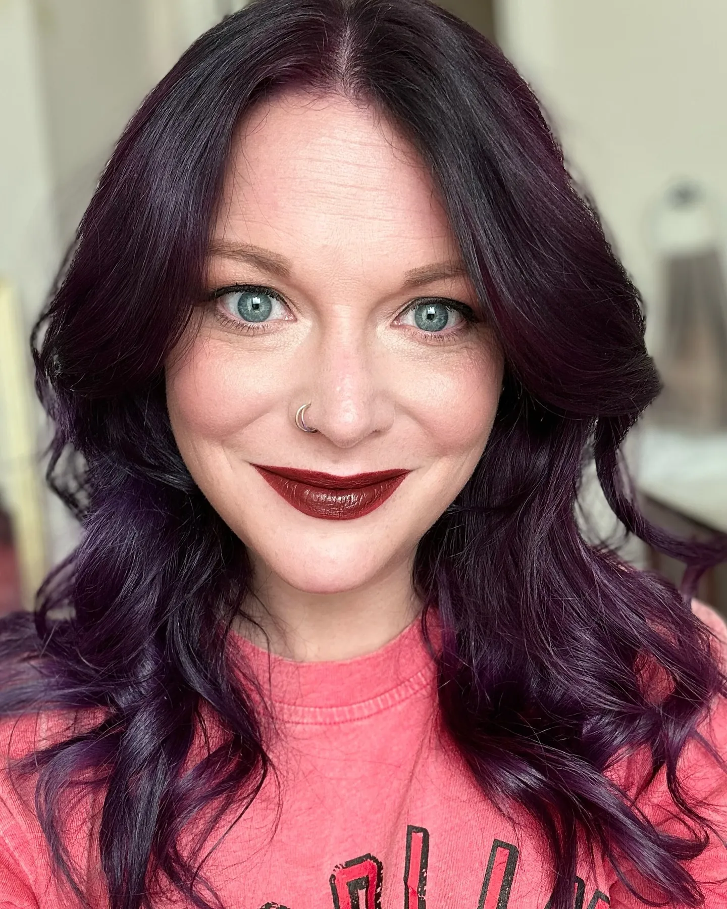 black cherry hair with face-framing waves