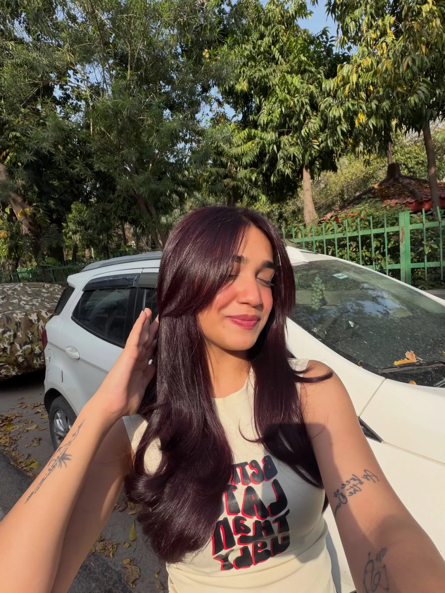 black cherry hair with long layered blowout