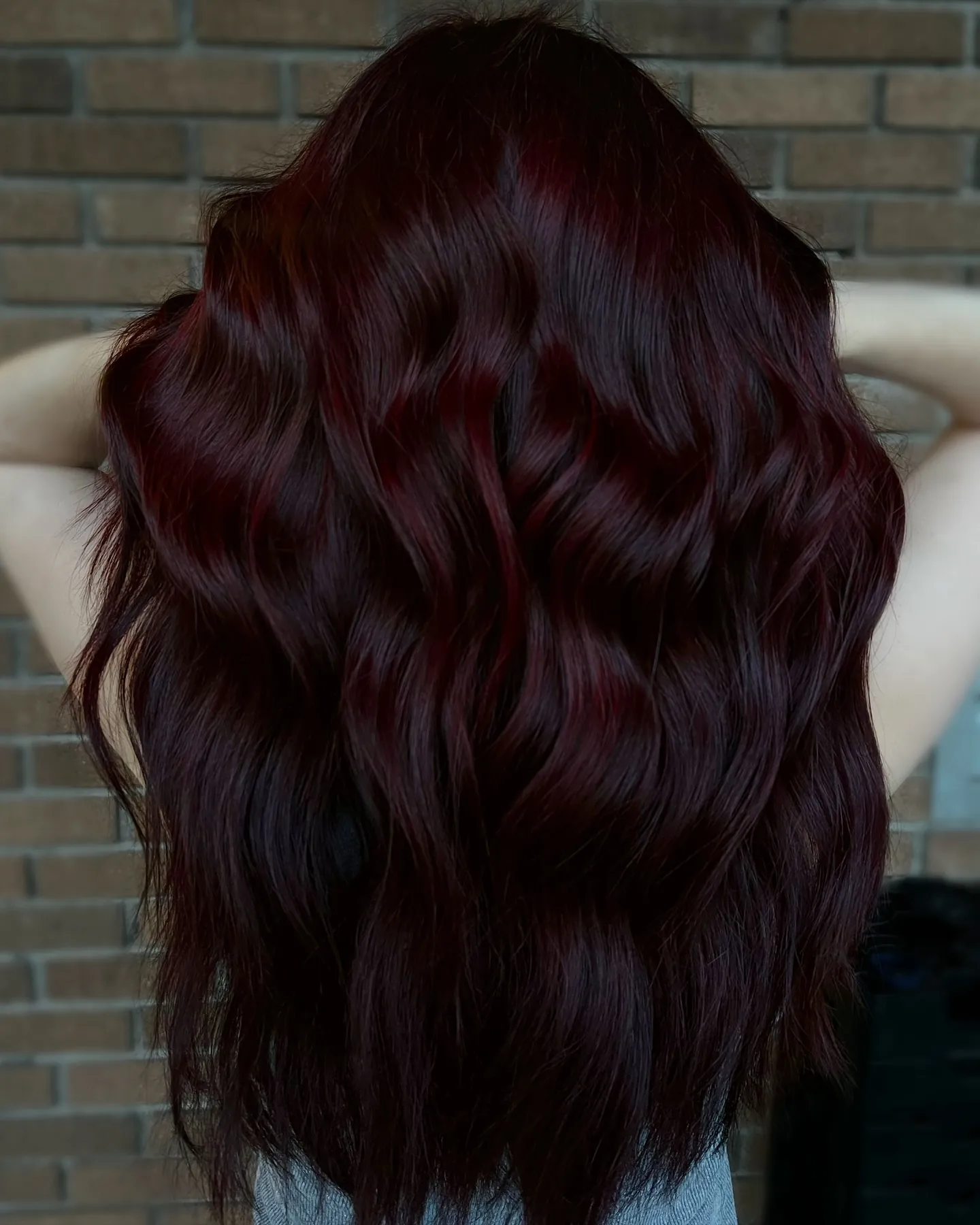 black cherry hair with cascading back waves
