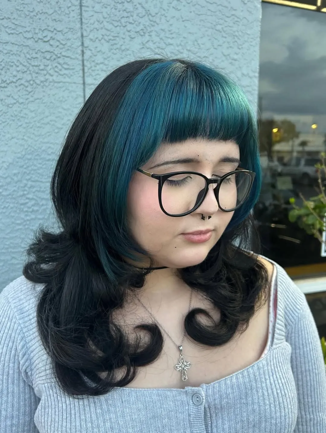 Curled Blue-Black Bob showing blue black hair colour