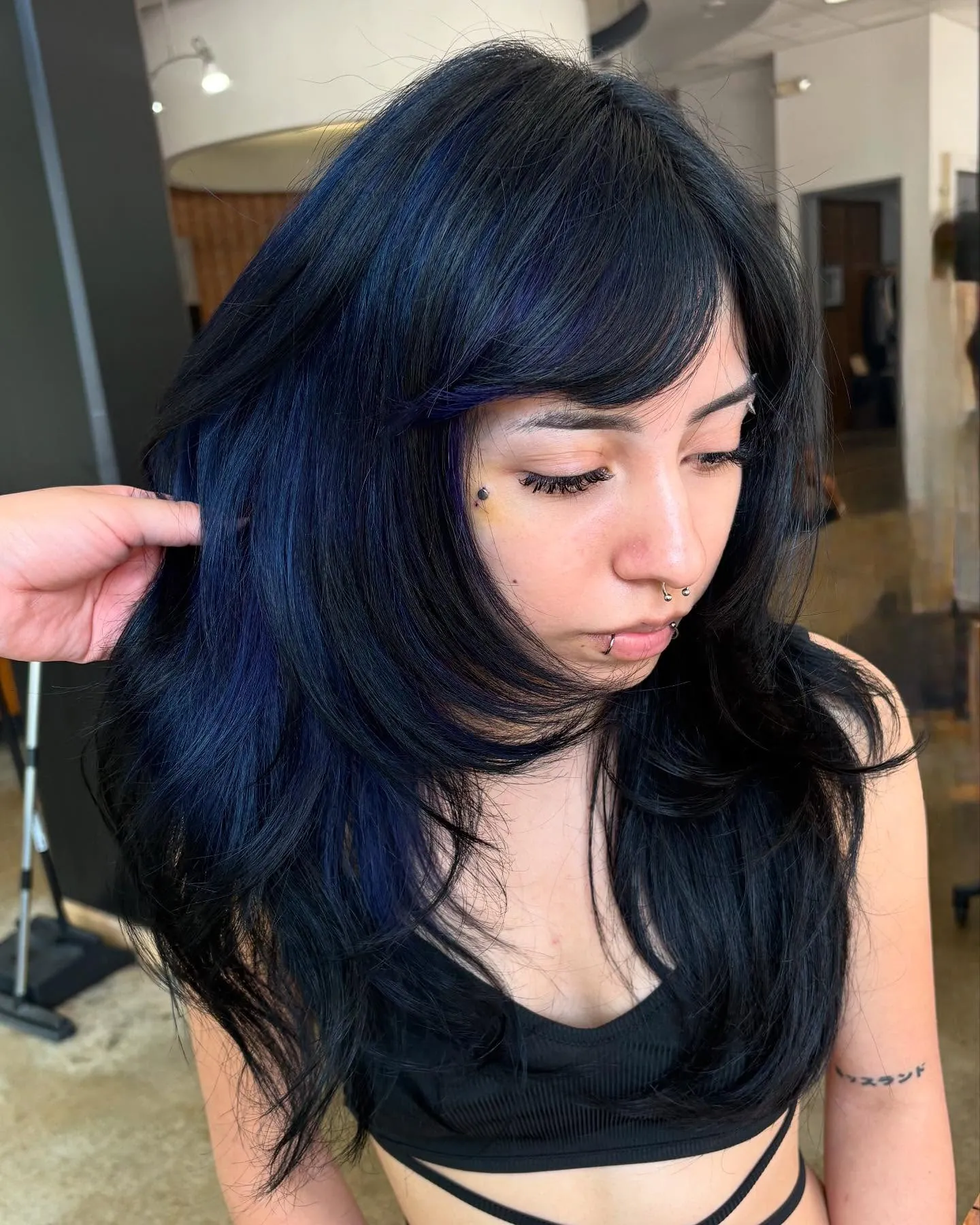 Blue-Black Layered Blowout showing blue black hair colour