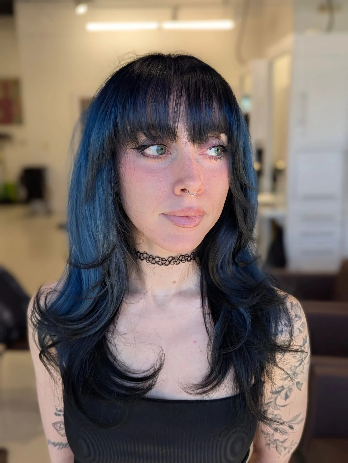 Blue-Black Fringe Layers showing blue black hair colour