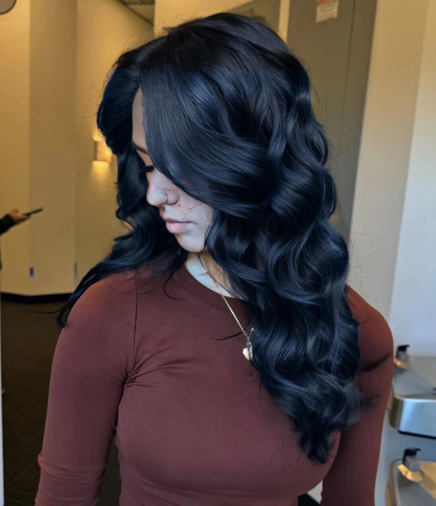 Glossy Blue-Black Curls showing blue black hair colour