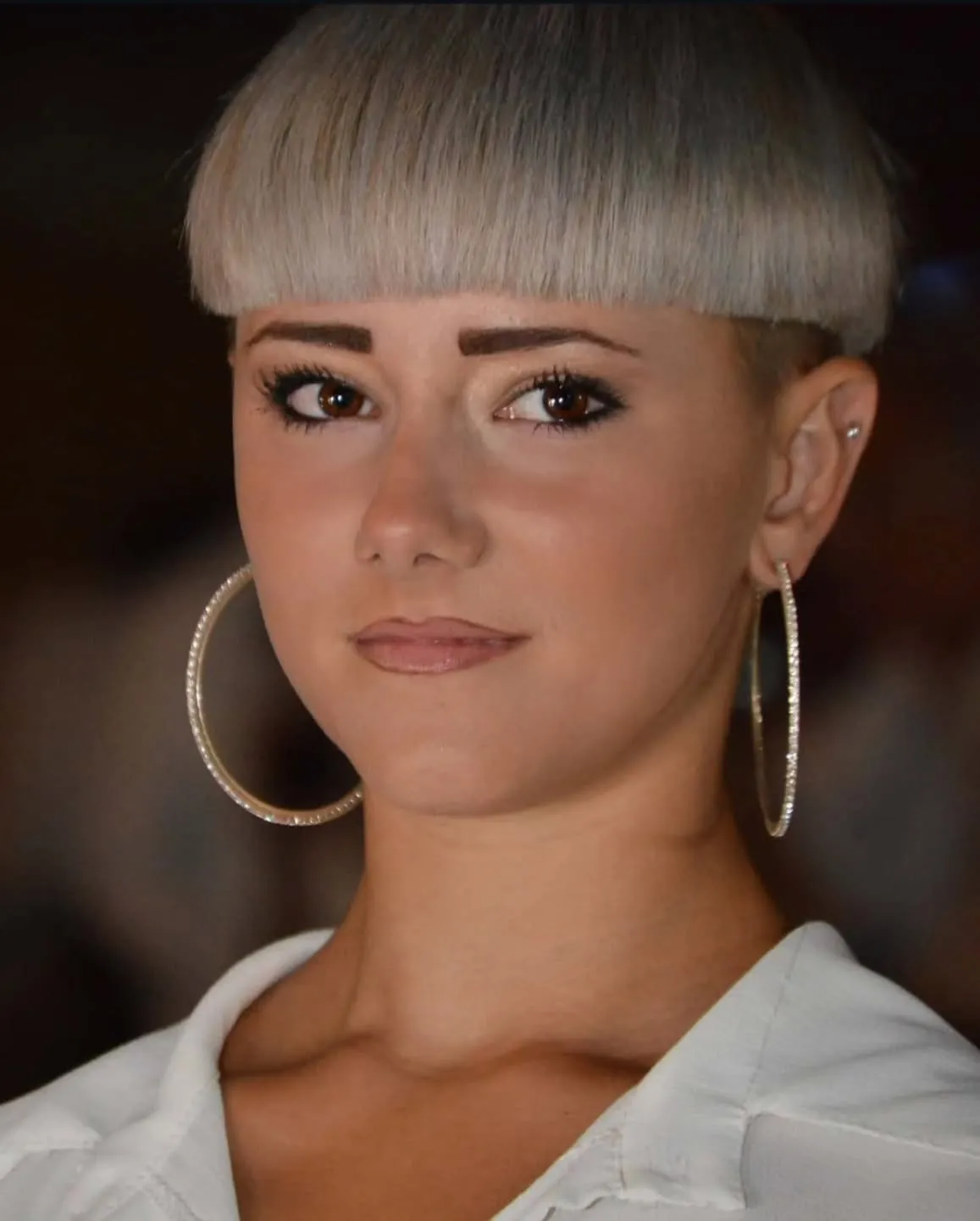 Blunt micro bowl cut with straight fringe and close cropped sides