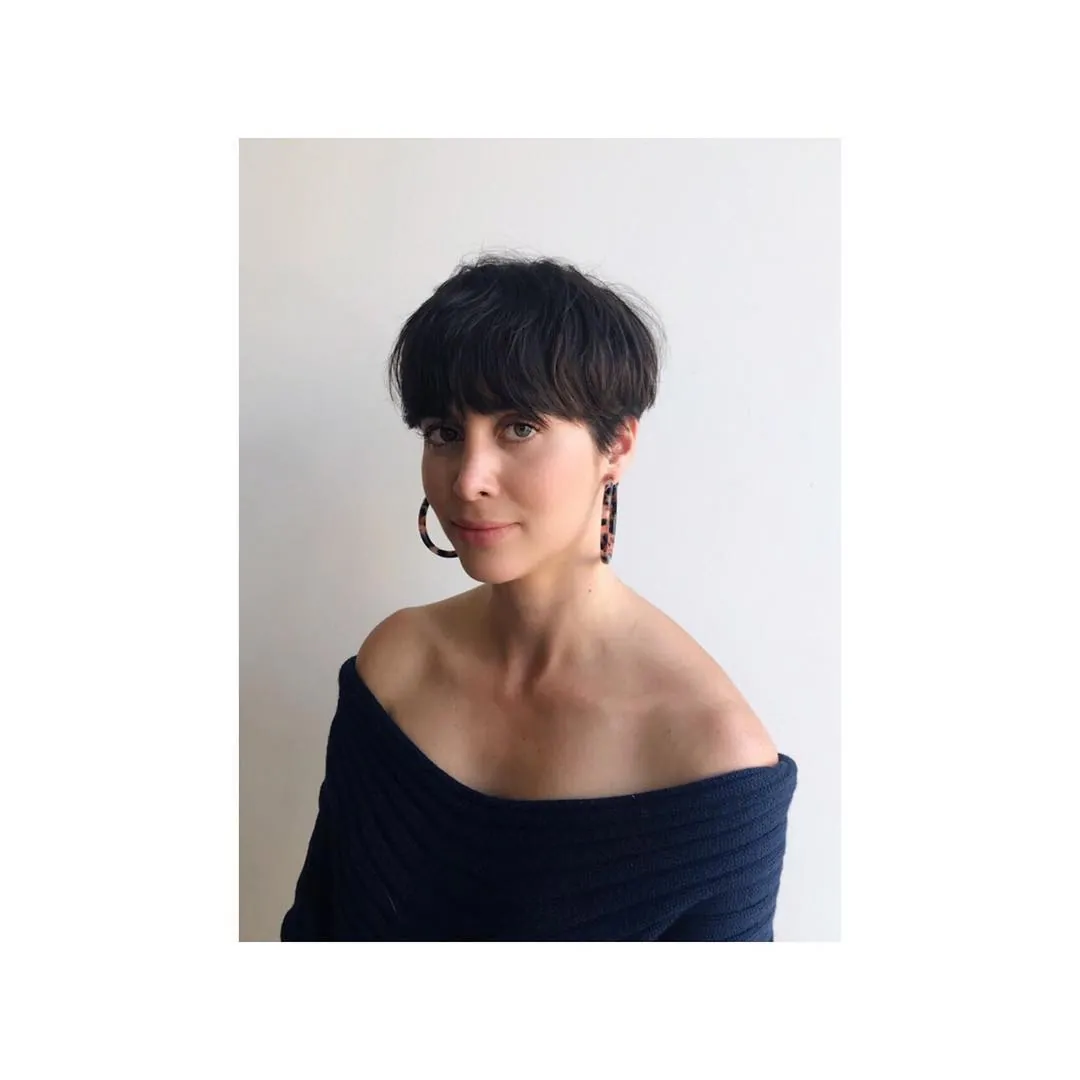Tousled black bowl crop with soft fringe